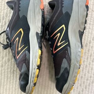 New Balance Black and Orange Athletic Shoes with Sporty Design